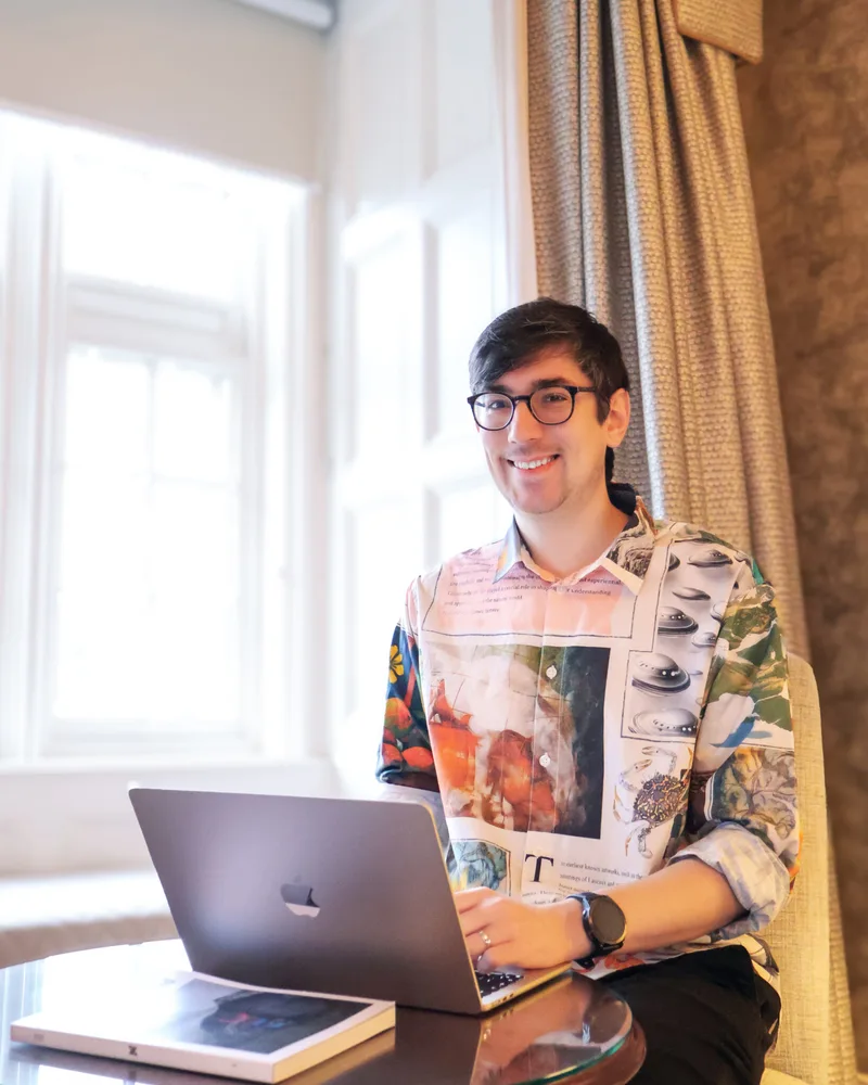 WorkflowMind’s founder working at his laptop